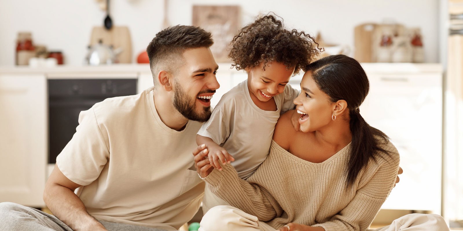 Happy parents and child laughing